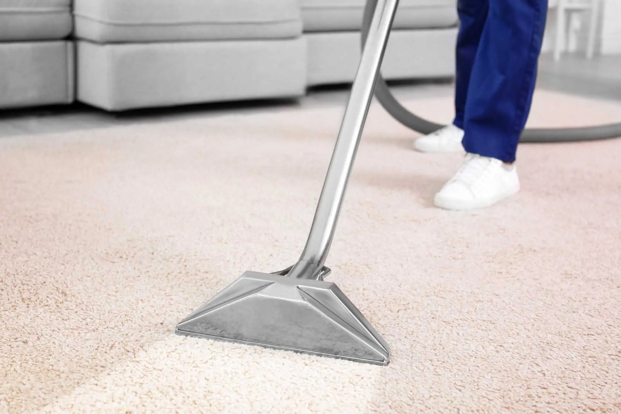 Picture of someone vacuuming their living room.