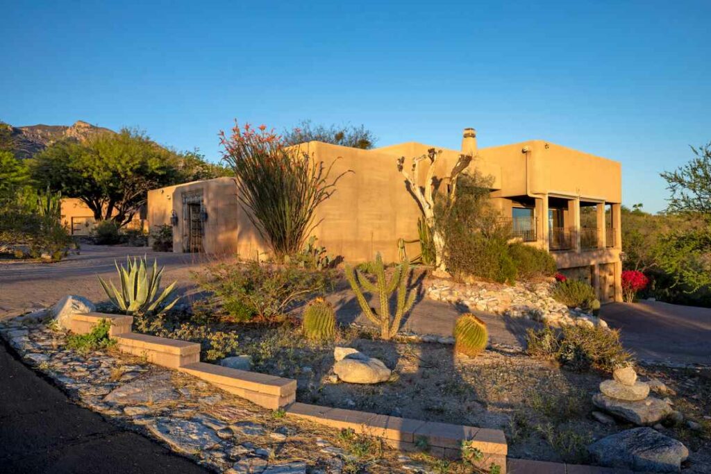 A contemporary adobe home at sunset.