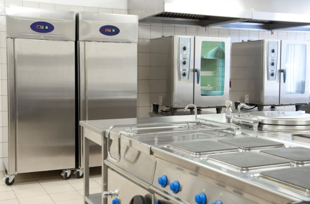 Empty restaurant kitchen with professional steel equipment 